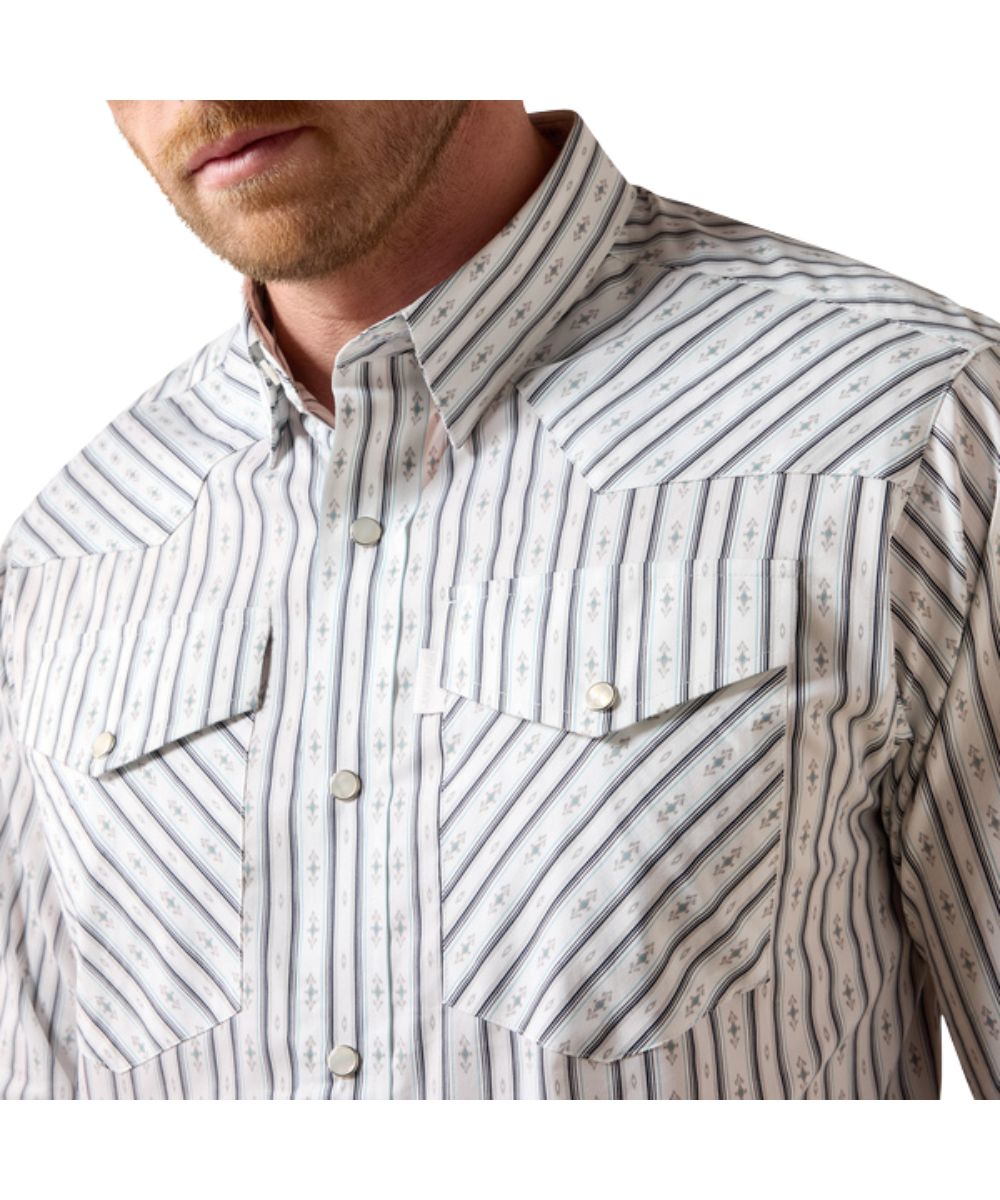 Close-up view of the men's white long sleeve classic fit snap shirt featuring the chest pockets, western yokes, and geo striped print