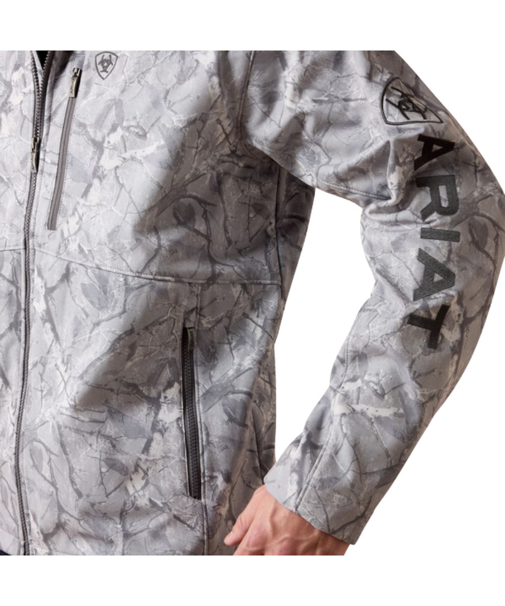 Close-up view of the zippered hand pocket and logo embroidery