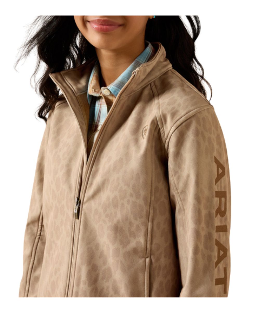 Close-up view of the logo embroidery, hand pockets, and mock collar
