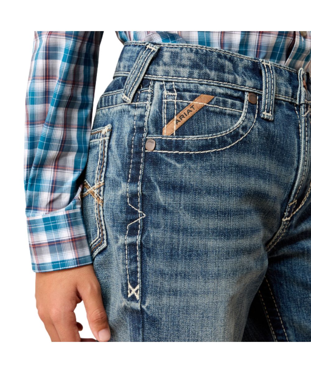 Close-up view of the front pocket featuring the heavy-duty hardware, extra deep front pockets, and reinforced belt loops