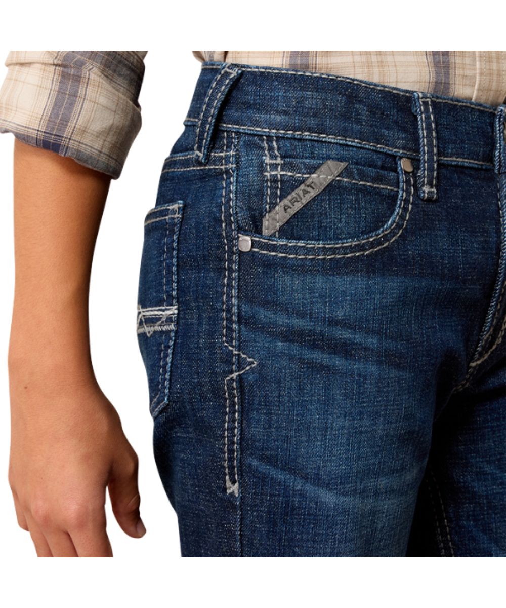 Close-up view of the front pockets featuring the slim fit, mid rise, heavy duty zipper and hardware, and the extra deep front pockets
