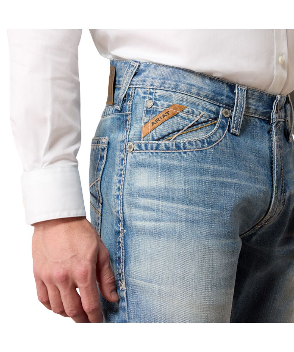 Close-up view of the front pocket featuring the extra deep front pockets, mid rise, and heavy duty zipper and hardware