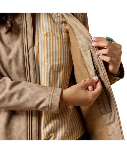 Interior view of the concealed carry zipper pocket inside the women's faded leopard softshell jacket