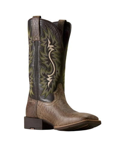 A single western cowboy boot shown in profile against a plain white background. The boot features a dark brown shaft with green and beige embroidered floral detailing, a medium brown leather foot, and a dark brown stacked heel.