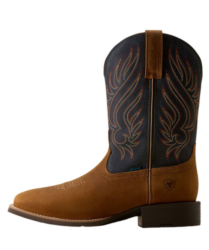 Left side view of the men's 11" cowboy boot featuring the tanbark vamp and navy shaft with a four-row stitch pattern