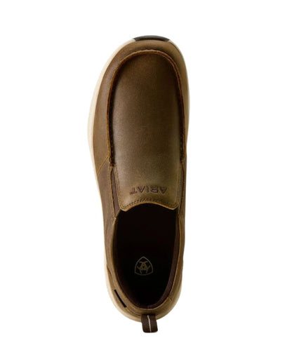 A single brown leather slip-on shoe shown from a top-down view on a plain white background. The brand name 'ARIAT' is embossed on the inner side of the shoe.