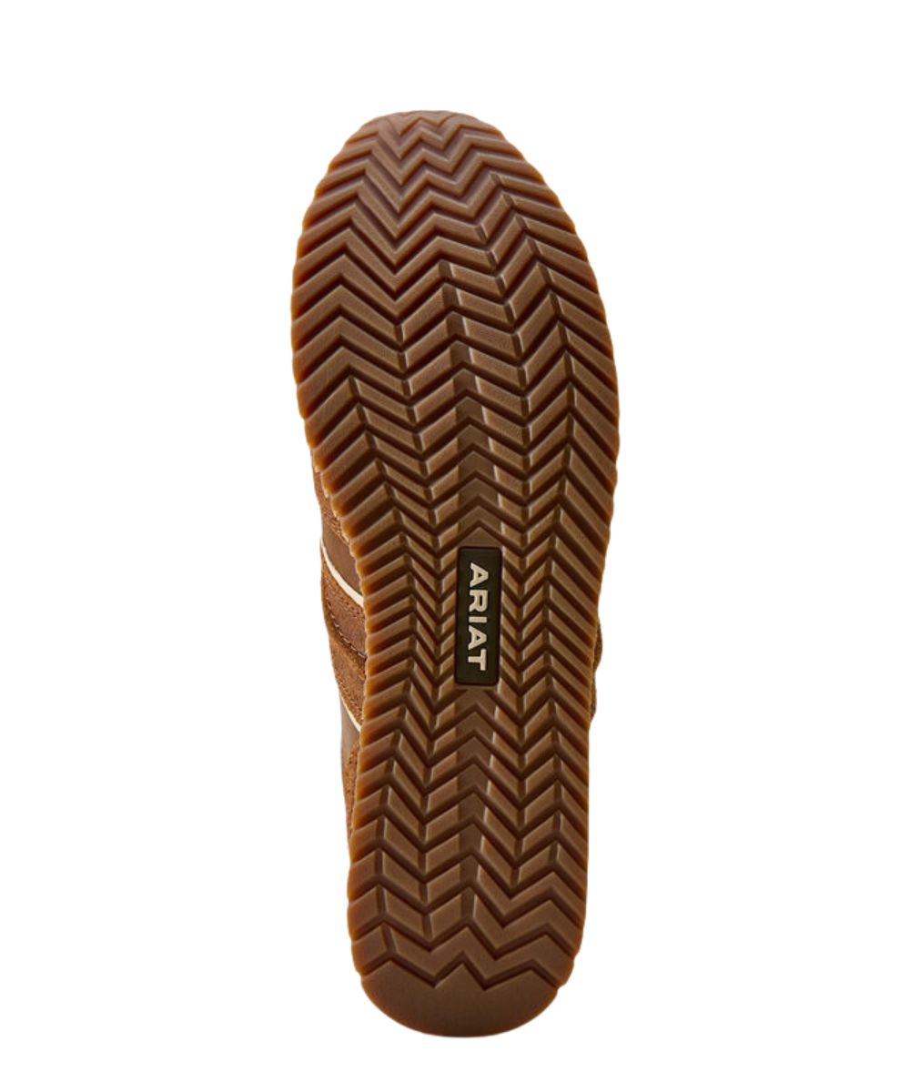 Sole view of a brown shoe sole with a herringbone tread pattern and ARIAT brand label in the center