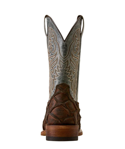 A single cowboy boot shown from the back on a plain white background. The boot features a dark brown leather lower section with a textured, scale-like pattern, and a tall shaft in a distressed silver-gray leather with light tan western embroidery.