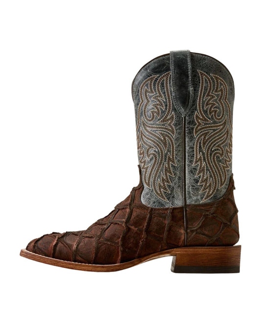 A single western cowboy boot with a dark brown crocodile-embossed toe and shaft, featuring a textured blue leather upper shaft with intricate white embroidery, set against a plain white background.