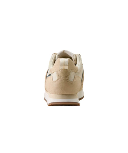 A beige suede sneaker shown from the rear three-quarter view, featuring a cream midsole and a small blue and white side stripe detail, set against a plain white background.