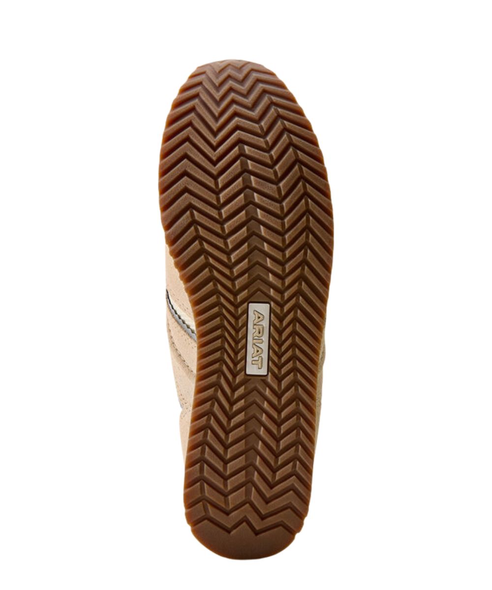 A top-down view of a shoe's sole, showing a brown herringbone-patterned rubber tread with a small white brand label reading 'ARIAT' in the center, on a plain white background.