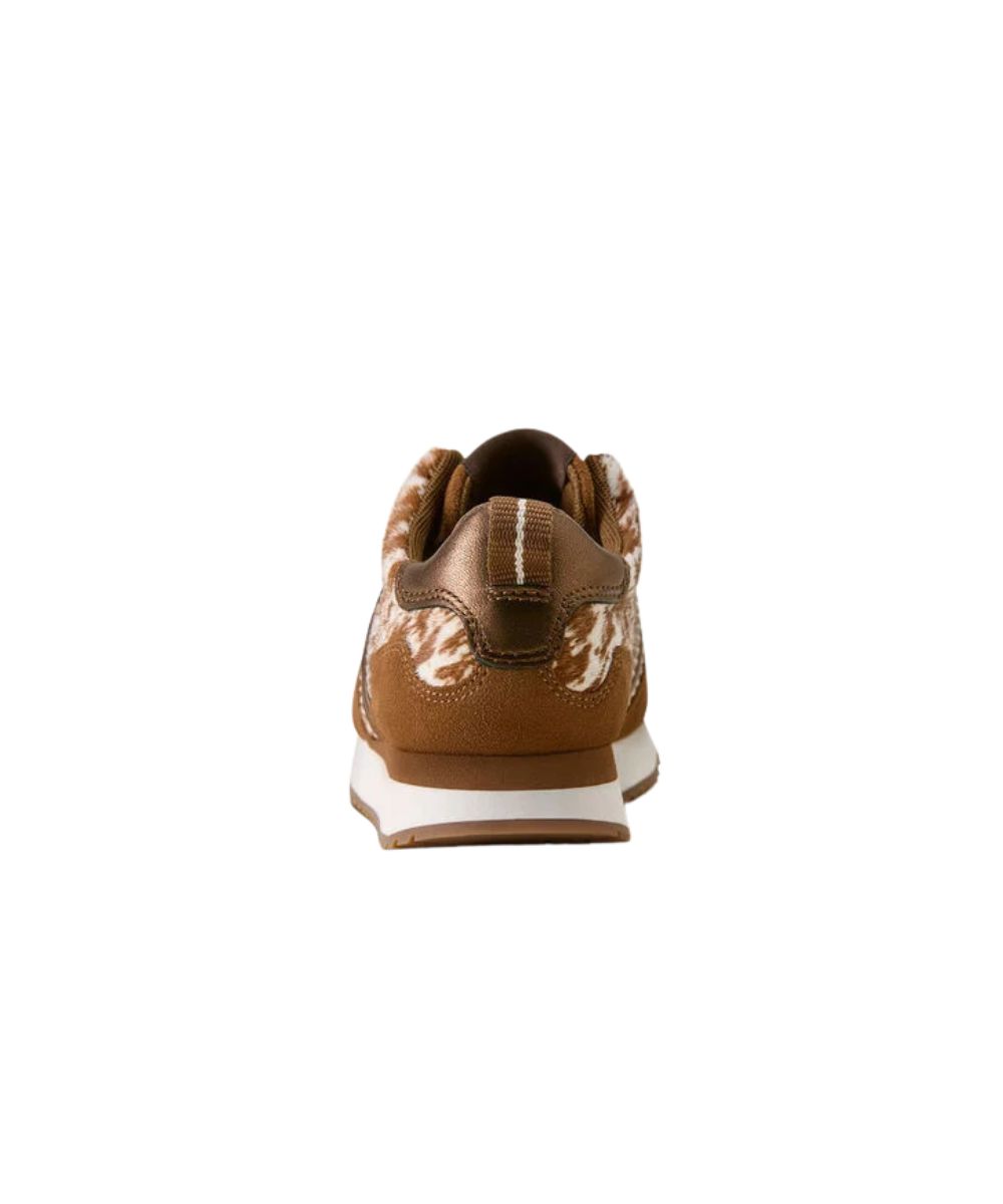 A single brown leather sneaker shown from the back, featuring a brown and white cow print pattern on the sides, a dark brown heel tab, and a white midsole.