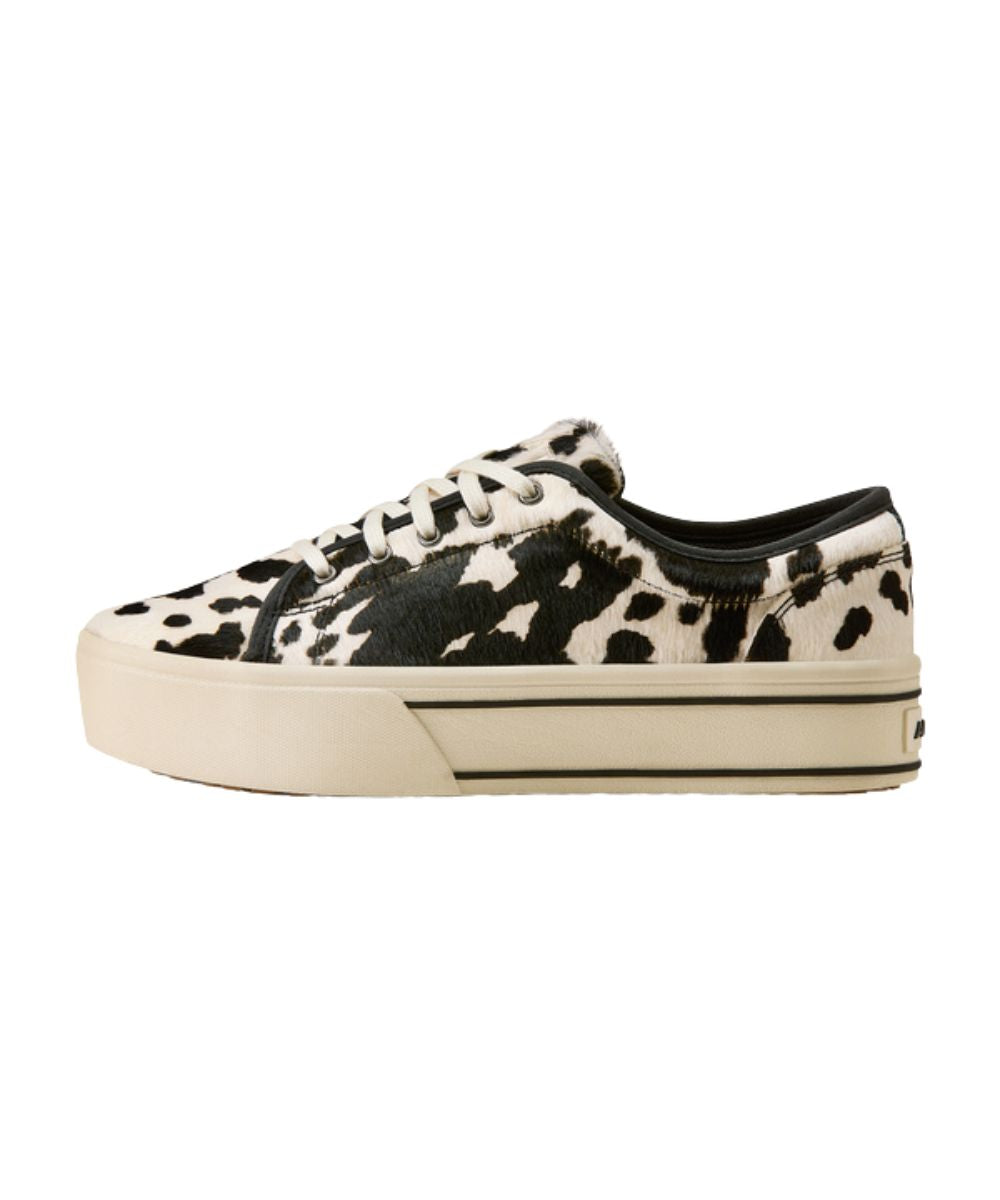 Left side view of the women's skylar shoe featuring the black and white hair-on cowhide leather shoe and the 1.5" platform sole