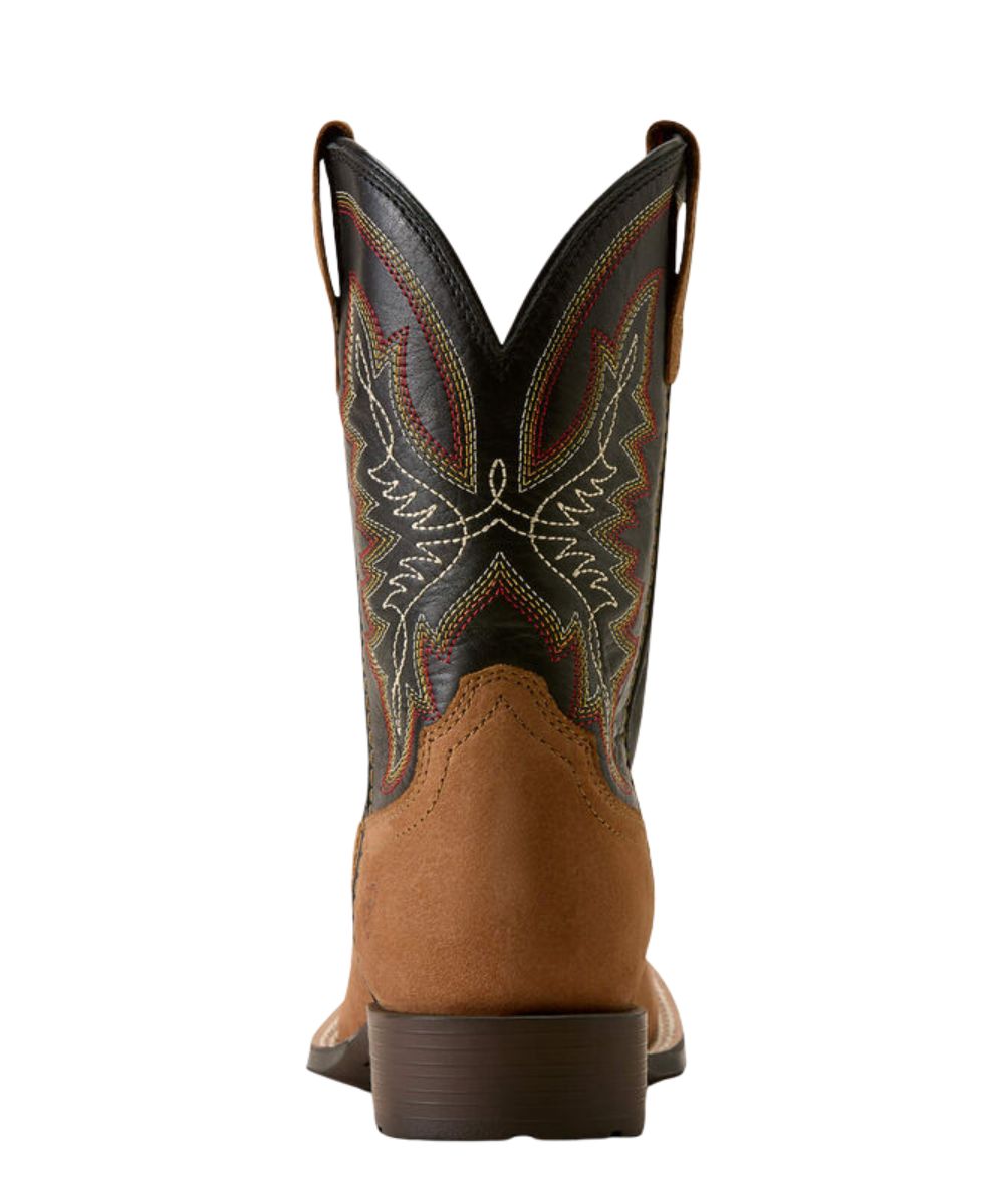 A single cowboy boot shown from the back on a plain white background. The boot features a tan leather lower section and a black shaft with multicolor embroidered patterns in white, red, and green.