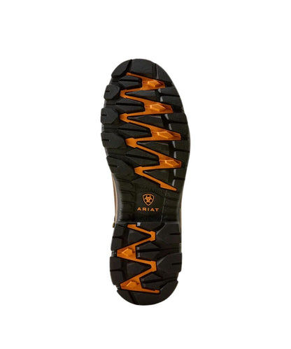 The outsole of a black Ariat hiking boot, showing aggressive tread patterns and bright orange accents, on a solid white background.