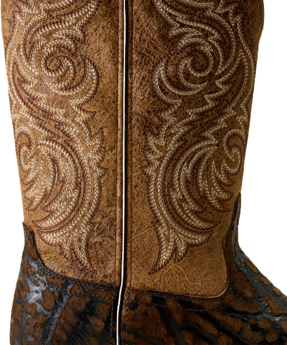 Close-up view of the distressed tan shaft featuring contrast western stitching and the brown rhino printed vamp