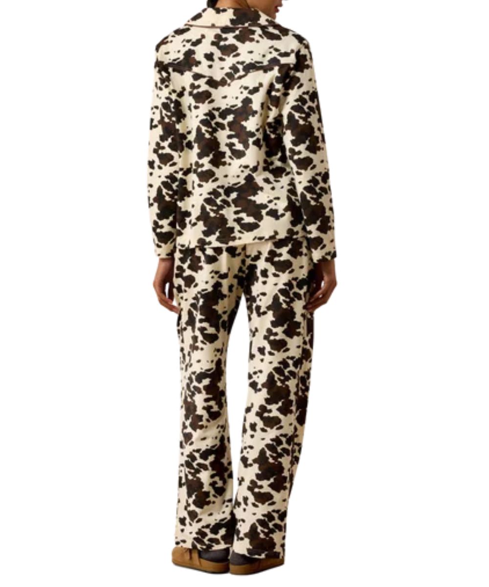 Back view of the women's brown and white Ariat Pony Play Pajama Set featuring the cow print long sleeve shirt and cow print pants, the back of the shirt features a single point back yoke