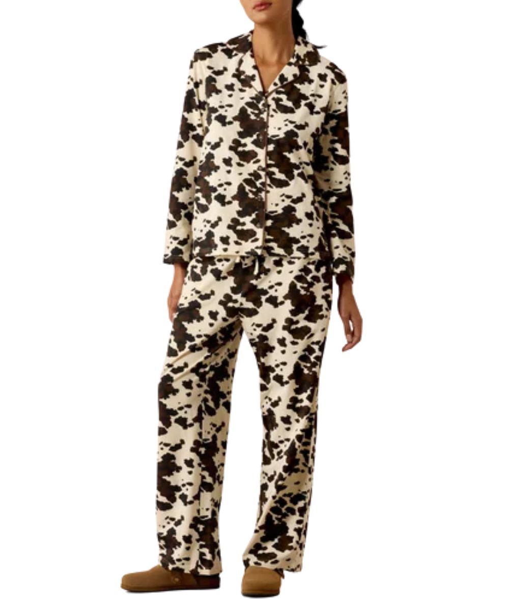Front view of the women's relaxed fit brown and white Ariat Pony Play Pajama Set featuring the cow print long sleeve shirt and cow print pants