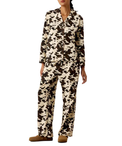 Front view of the women's relaxed fit brown and white Ariat Pony Play Pajama Set featuring the cow print long sleeve shirt and cow print pants