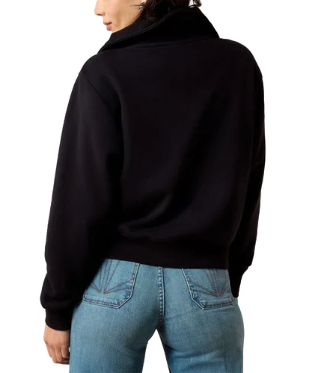 Back view of the women's solid black long sleeve pullover featuring the soft wrapped collar