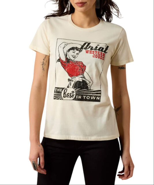 Front view of the women's Ariat Best In Town Graphic Tee Natural-colored with a pin-up style graphic that reads "Ariat Western Boots The Best In Town"