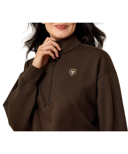 Close-up view of the women's brown sweatshirt featuring the contrast logo embroidery at the left chest