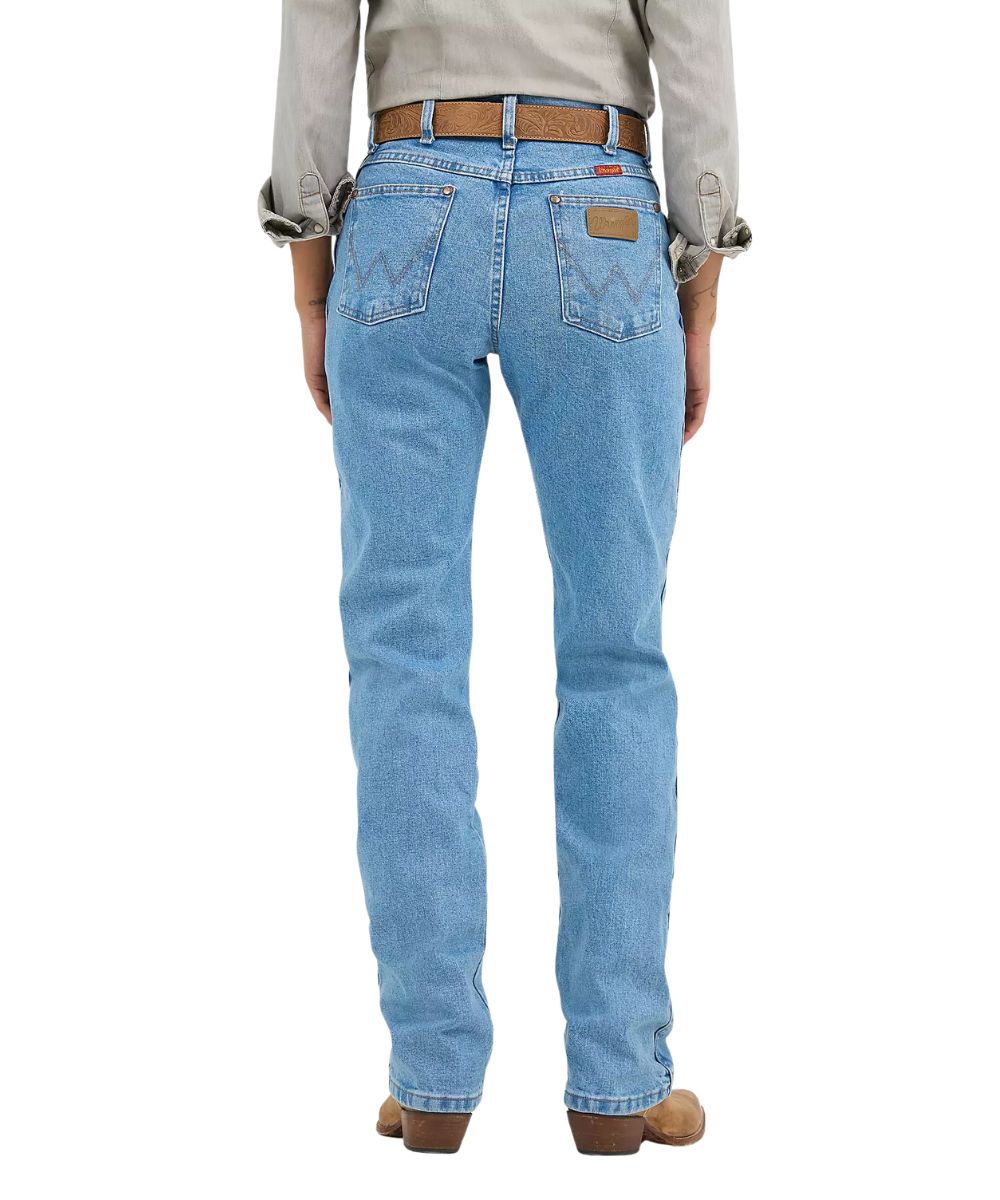 Back view of the women's Wrangler cowboy cut jeans in an antique wash
