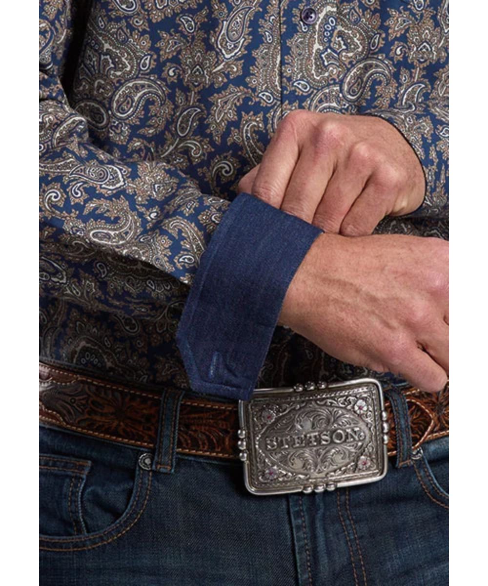 Close-up view of the navy and gold paisley print and the contrast interior denim trim