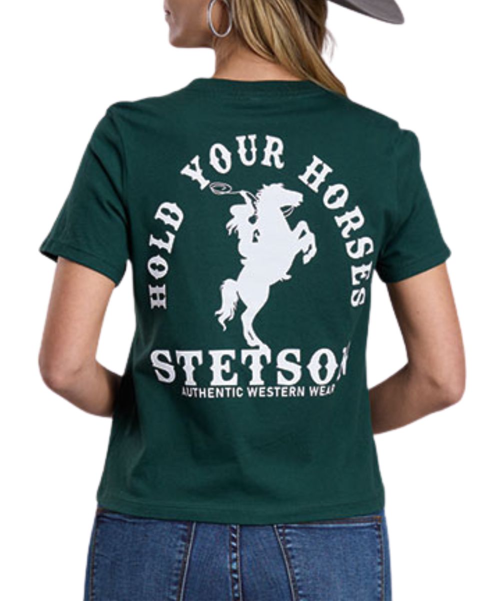 Back view of the women's forest green Stetson graphic tee featuring the rearing horse white screen-printed graphic that reads: "Hold Your Horses - Stetson Authentic Western Wear"
