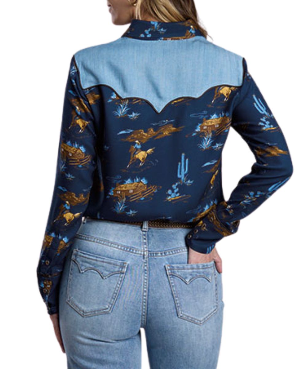 Back view of the women's navy long sleeve snap shirt featuring the triple pointed back denim yoke and snap cuffs
