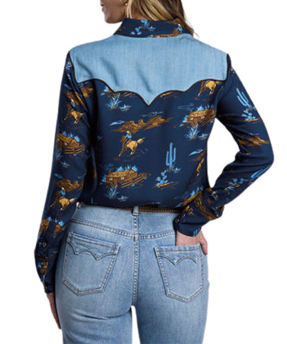 Back view of the women's navy long sleeve snap shirt featuring the triple pointed back denim yoke and snap cuffs