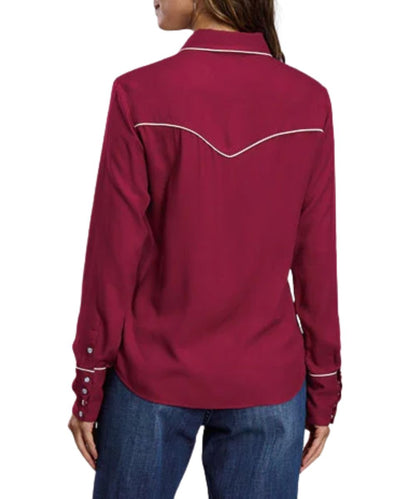 Back view of the women's wine long sleeve snap shirt featuring the single point back yoke with cream piping, and the 4-snap cuffs