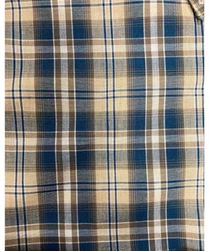 Close-Up View Of The Tan And Blue Plaid Print