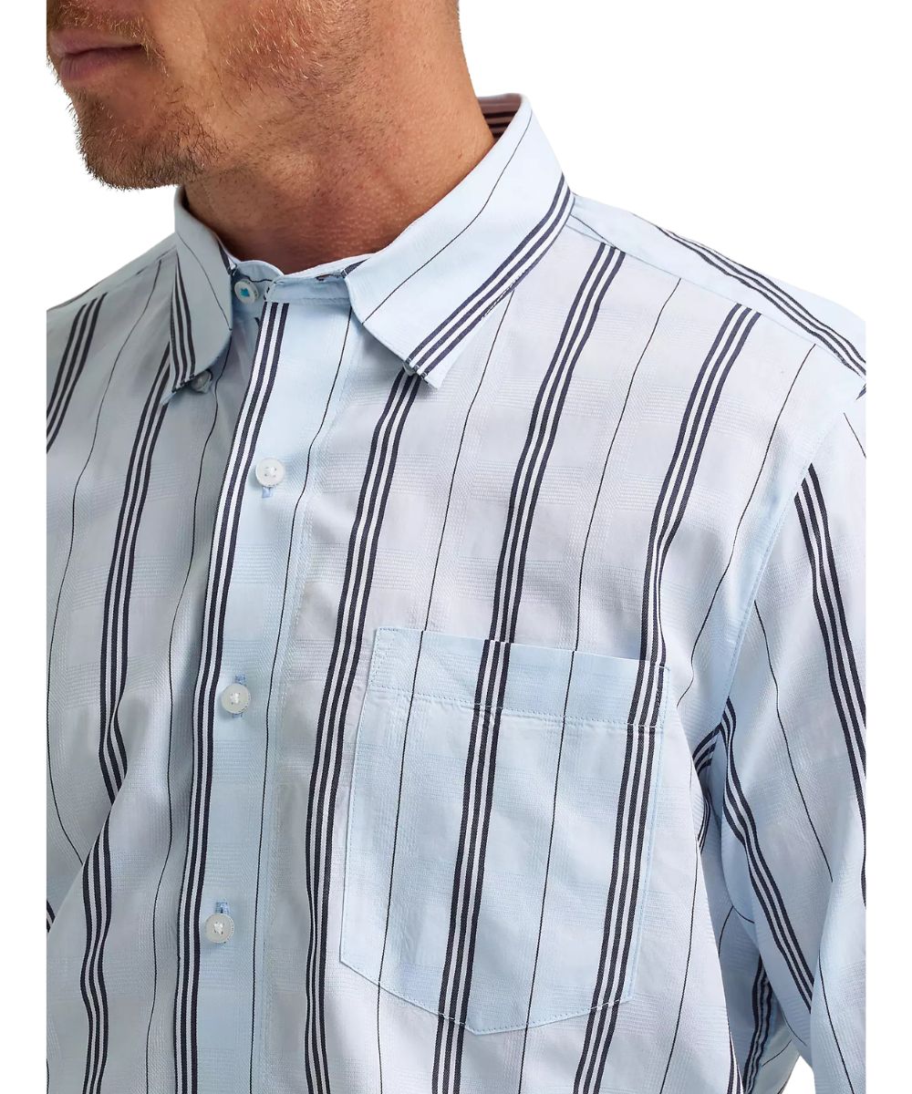 Close-up view of the men's button-down shirt featuring a single open chest pocket and a hidden button-down collar.