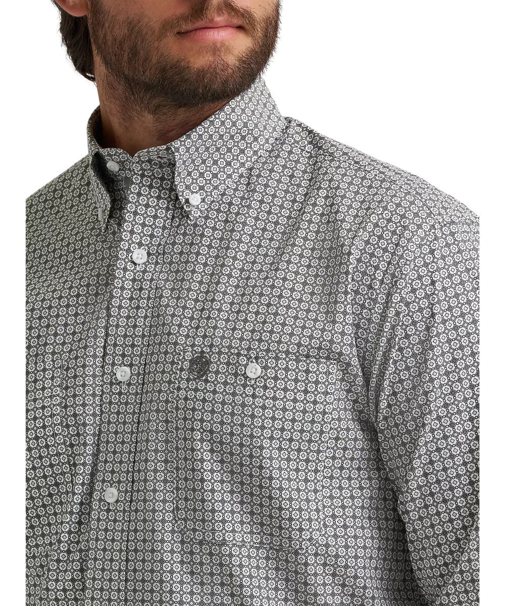 Close-up view of the grey board printed shirt featuring button-through chest pockets and a button-down collar. 