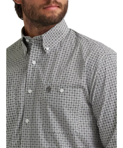 Close-up view of the grey board printed shirt featuring button-through chest pockets and a button-down collar. 