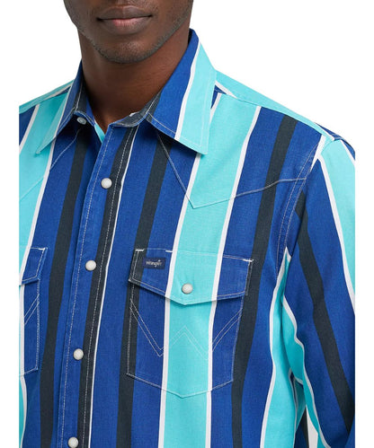 Close-up view of men's long sleeve western work shirt featuring western yokes, pearl snaps, and a pen/pencil slot in the left chest pocket.