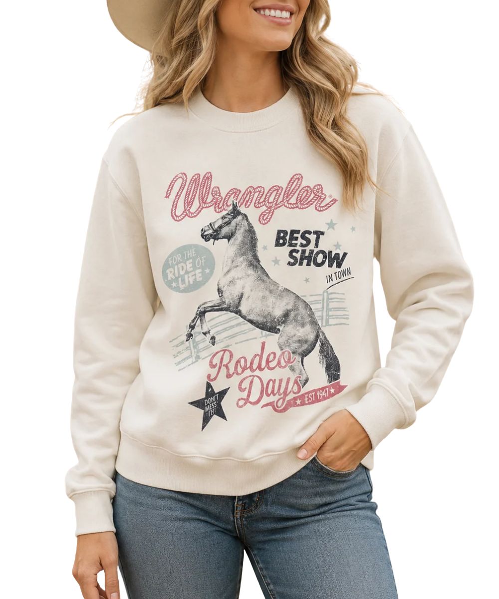 Model view of the women's Wrangler Rodeo Shimmer Egret Pullover featuring the rodeo graphic on the front