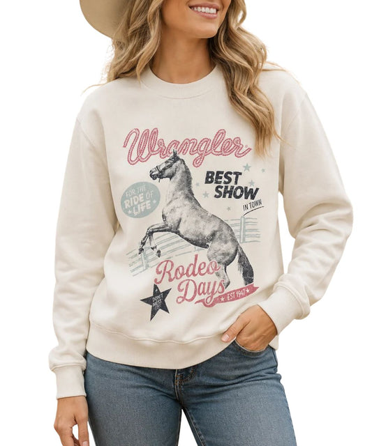 Model view of the women's Wrangler Rodeo Shimmer Egret Pullover featuring the rodeo graphic on the front