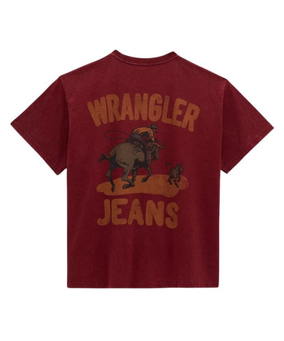 A maroon short-sleeve t-shirt with a distressed graphic on the back featuring the text 'WRANGLER JEANS' and an illustration of a cowboy riding a bucking steer.