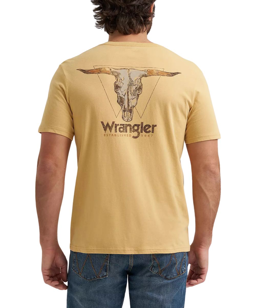 model from behind wearing yellow tshirt with steer skull design with jeans and white background