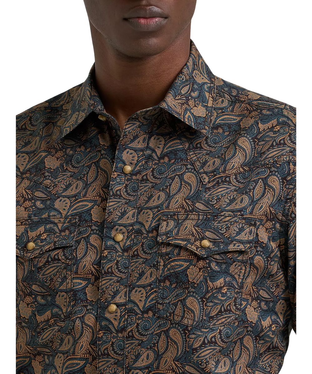 Close-up view of the royal scroll print, snap flap chest pockets, and western yokes