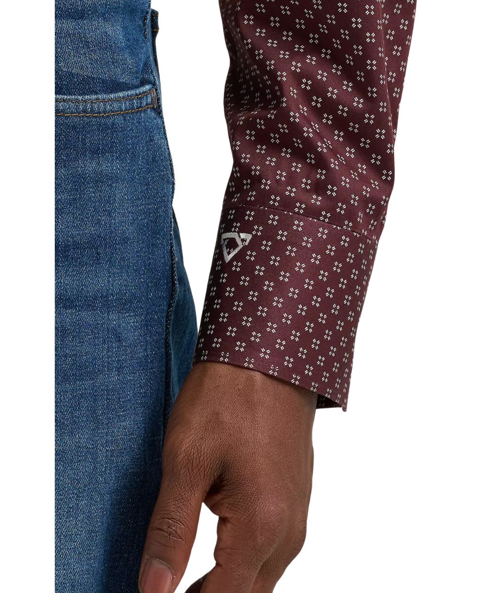 Close-up view of the mitered cuff featuring cody johnson's signature logo embroidery on the men's wine button down shirt