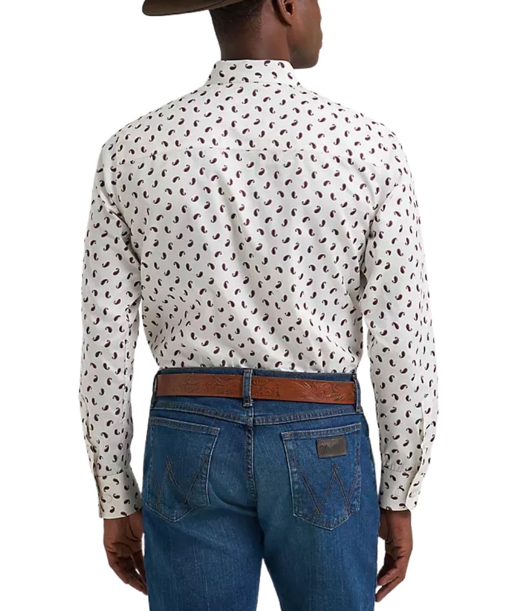 Rear view of a man wearing a white long-sleeve button-down shirt with a small wine paisley pattern, tucked into blue jeans with a brown belt, against a white background.