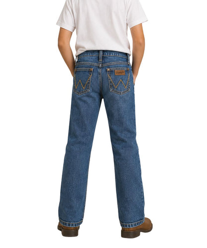 Back view of the boy's retro dark wash slim boot cut jean