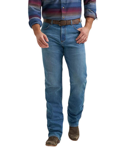 Front view of the men's dark wash relaxed fit boot cut jean featuring a mid rise