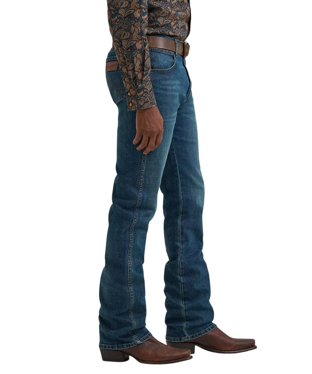 Side view of the men's retro slim boot cut jean in a dark wash