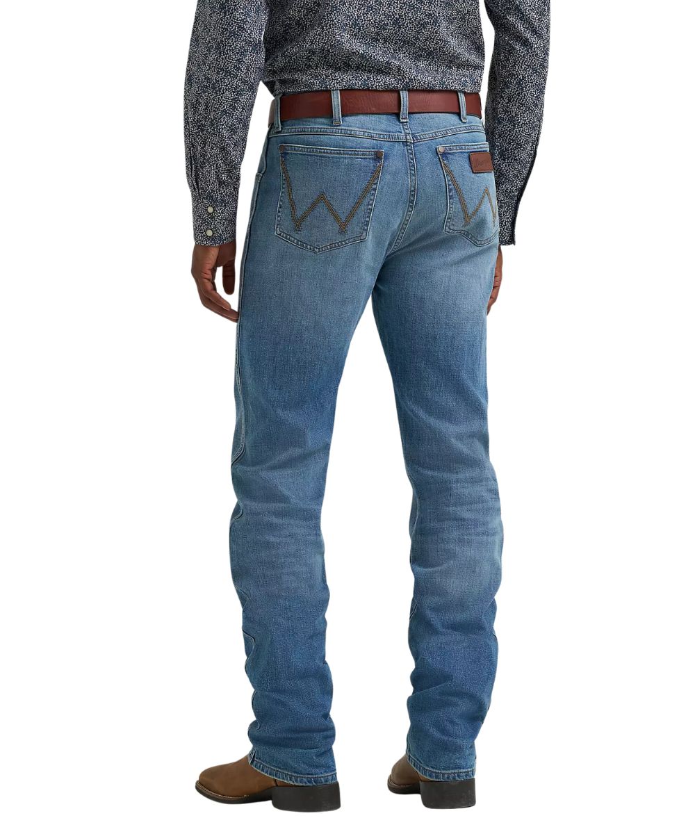 Back view of the men's medium wash slim straight leg jean