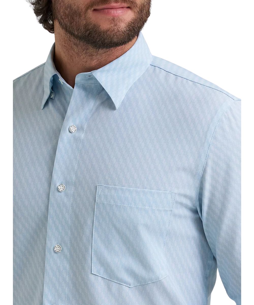 Close-up view of the single open chest pocket, the hidden button-down collar, and the aqua hexagon print