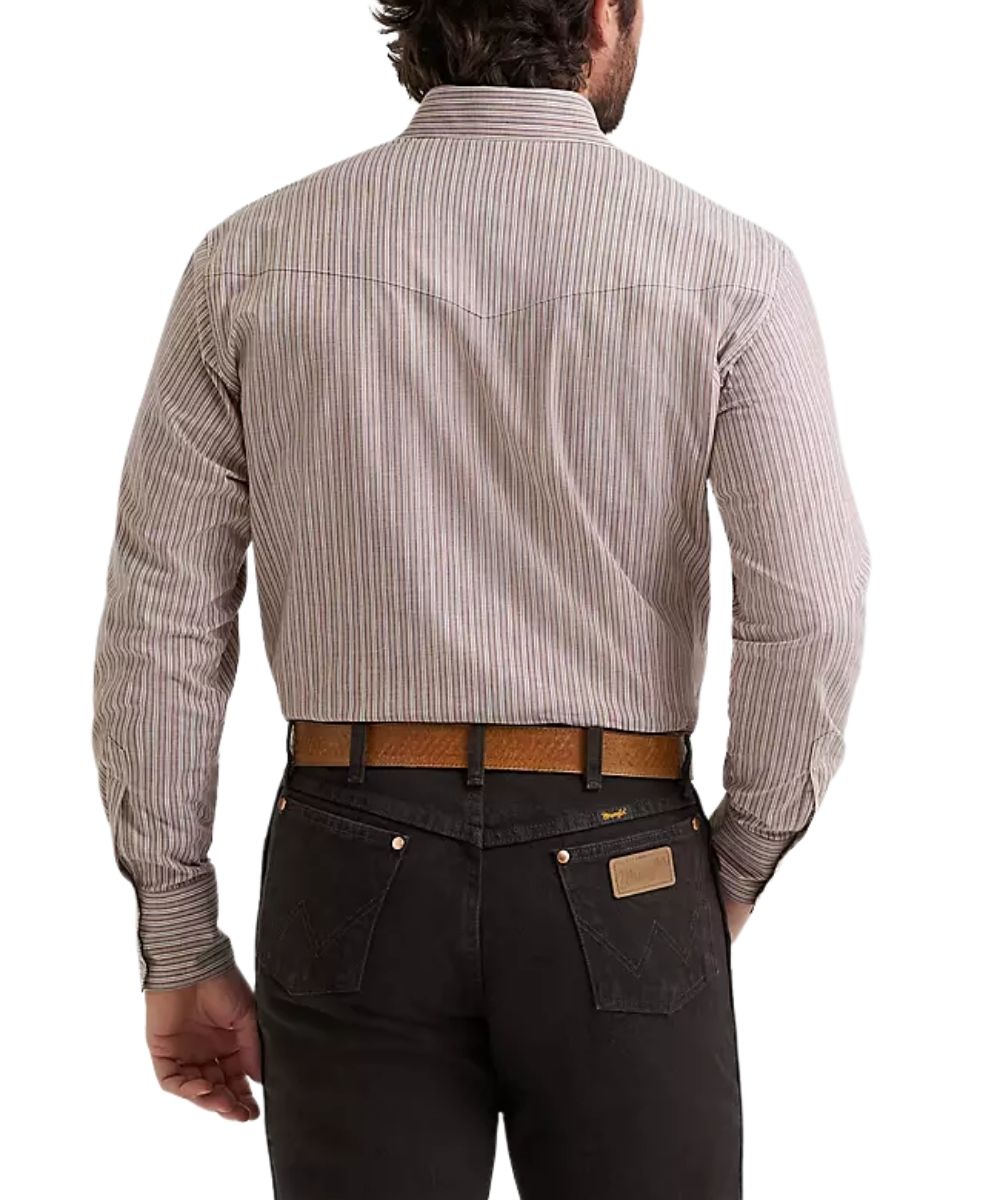 Rear view of a man wearing a long-sleeve button-down shirt with thin vertical stripes in beige and cinnamon, paired with dark jeans and a brown belt, against a plain white background.